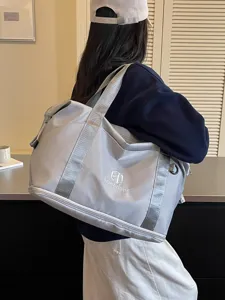Casual travel duffle bag for women, portable fitness sports bag with shoulder strap.