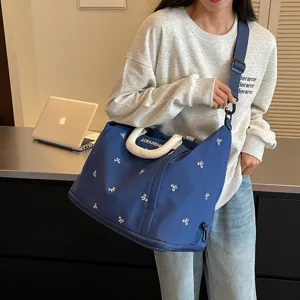 Gran bolsa de viaje con bordado de lazo, bolso deportivo ligero para viajes cortos.