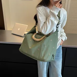 Bolso de viaje grande con lazos bordados, bolso de hombro de lona verde para mujer.