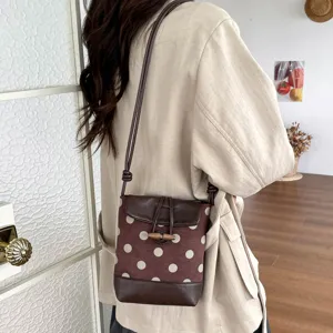 Chic polka dot crossbody phone bag for women, stylish small shoulder bag with flap design.