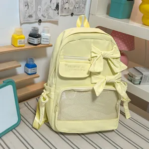 Süßer Schleife Schulrucksack für Damen, ästhetischer gelber Nylon Alltagsrucksack mit Klarsichtfach.