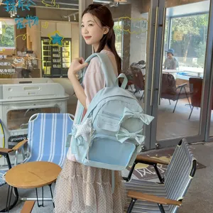 Süßer Schleifen Rucksack für Damen und Mädchen, stilvoller hellblauer Schulranzen mit Netztasche.