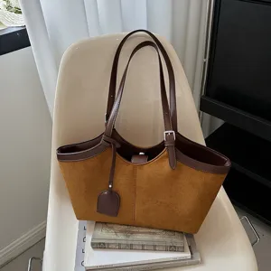 Detail view of retro brown women tote bag, PU leather suede large capacity shoulder handbag.
