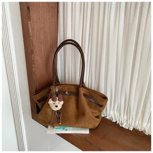 Brown suede pleated women tote bag, stylish casual shoulder handbag with cute bear pendant.