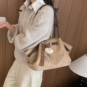 Korean style suede shoulder tote bag for women, chic commuting casual handbag with cute pendant.