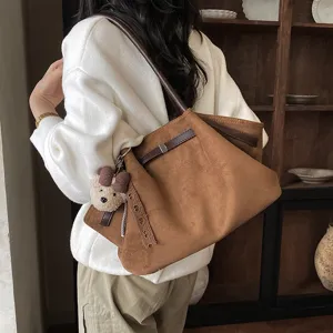 Korean style brown suede pleated shoulder tote bag detail, fashionable commuter handbag.