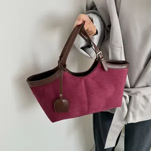 Vintage suede tote bag for women, stylish contrast color shoulder handbag with large capacity.
