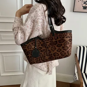Detailed view of women leopard print shoulder bag, retro underarm bag design with black strap.