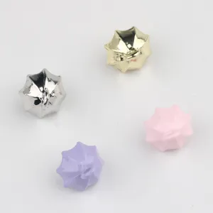 Closeup of colorful umbrella shape alloy charms pendants for DIY jewelry making accessories.