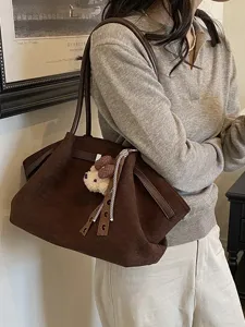 Korean style brown suede slouchy tote bag for women, commuter shoulder handbag with bear charm.