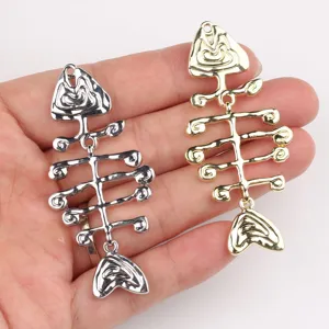 Metal fish bone pendant detail view, silver and gold diy jewelry accessories close-up