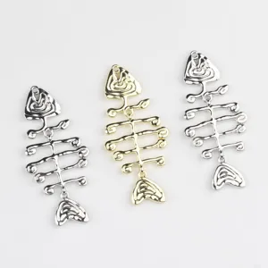 Close-up detail of metal alloy fish bone charms, DIY jewelry making accessories parts.