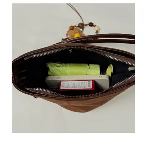 Brown suede bucket bag for women stylish shoulder underarm bag capacity detail view