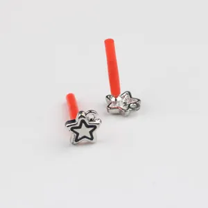 Close-up detail of alloy star charm DIY jewelry accessory featuring a red support post component
