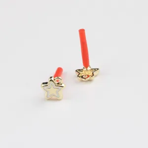 Gold alloy star ear post component detail, white enamel fill, DIY handmade jewelry supply.