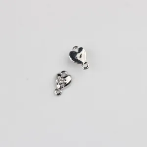 Detail shot of silver heart double hanging connector, alloy zircon DIY jewelry accessory.