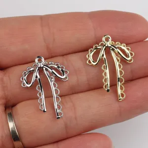 Alloy hollow lace bow pendant DIY charm for handmade bracelet necklace earrings decor.