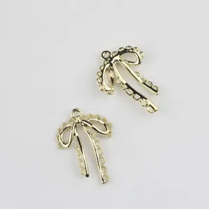Gold hollow bow pendant detail shot, perfect for DIY jewelry making like necklaces and bracelets.