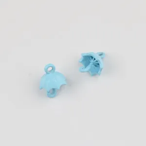 Detail view of light blue painted alloy umbrella pendant charms for DIY jewelry making items.