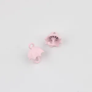 Pink alloy umbrella pendant detail view, perfect for DIY jewelry crafting like necklaces and earrings.