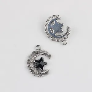 Silver alloy moon and star pendant charm with clear and black rhinestones for DIY jewelry.