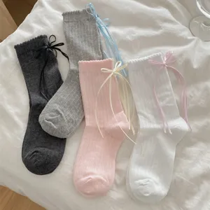 Women cute sweet JK style mid-calf socks with sweet ribbon bows and lace ruffles soft cotton.