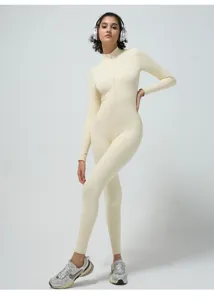 Ribbed long sleeve zipped yoga jumpsuit, seamless fitness activewear for women pilates training.