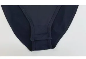 Black bodysuit detail shot showcasing elastic fabric and fine stitching craftsmanship.