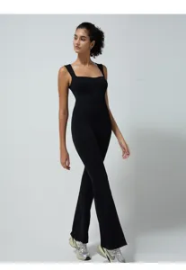 Black ribbed sleeveless square neck flared yoga jumpsuit detail view for fitness and pilates.