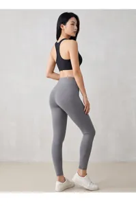 Detail view of high waist yoga pants and sports bra, comfortable stretch fitness activewear.