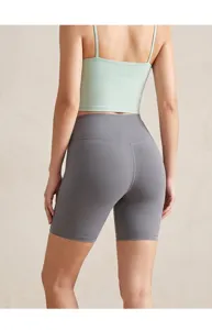 High waisted seamless yoga shorts detail shot, showing back view and peach butt lifting fit.