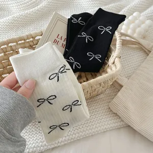 Detail view of stylish bow pattern mid-calf cotton socks in elegant Korean ballet style.
