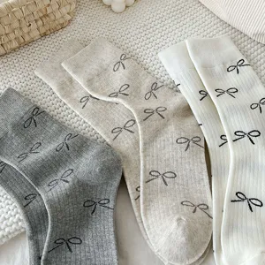 Korean style bowknot mid-tube socks for women, vintage cotton socks in grey, white, and khaki.
