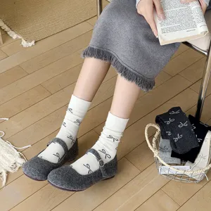 Gray wool Mary Jane shoes with cute white bow print mid tube socks detail shot cozy style