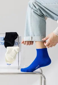 Men's breathable mid-tube cotton socks with stylish letter print for daily sports and casual wear.