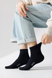 Men black cotton athletic crew socks with stylish letter print for everyday sports wear.