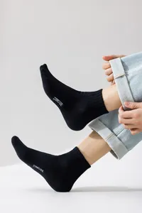 Men black mid-calf socks with white letter print, breathable cotton casual sports socks.