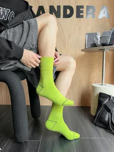 Green mid-calf men's cotton socks with ribbed cuffs, breathable streetwear athletic socks.