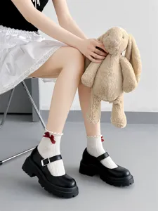 Japanese JK style white lace frill socks featuring cute red bow details, perfect for lolita style.