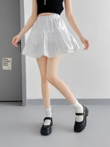 White lace ruffle crew socks paired with cute JK style outfit and Mary Jane shoes detail view.