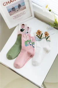 Cute floral cotton mid-calf socks for women, stylish 3D tufted flower knit socks daily.