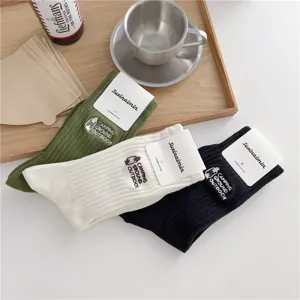 Retro camping style mid-tube socks with embroidered lantern and combed cotton for everyday wear.