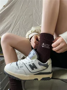 Retro camping style brown cotton mid-calf socks with cute lantern embroidery for women and men.