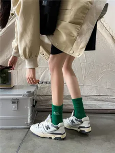 Retro green embroidered mid-tube socks featuring outdoor camping style for women and men.