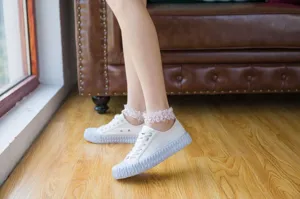 Detailed view of women's sheer lace ruffle socks with breathable mesh, spring summer style.
