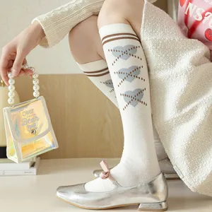 Chaussettes hautes style collège français pour femmes, chaussettes longues rétro rayées.