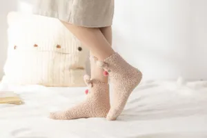 Thickened coral fleece warm winter women socks with cute rabbit ears and fluffy pom pom design.