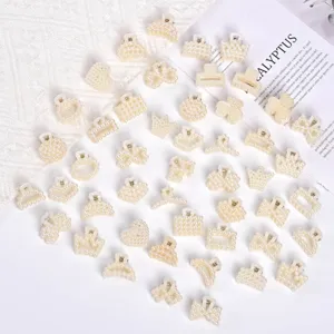 Set of elegant small pearl hair claw clips in various shapes for feminine styles.