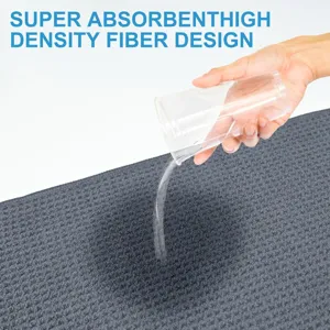 Detail of grey microfiber golf towel showing super water absorption capability.