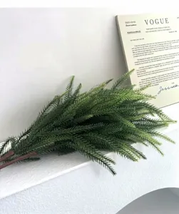 Macro detail of green artificial Norfolk pine needle branches for Christmas decor